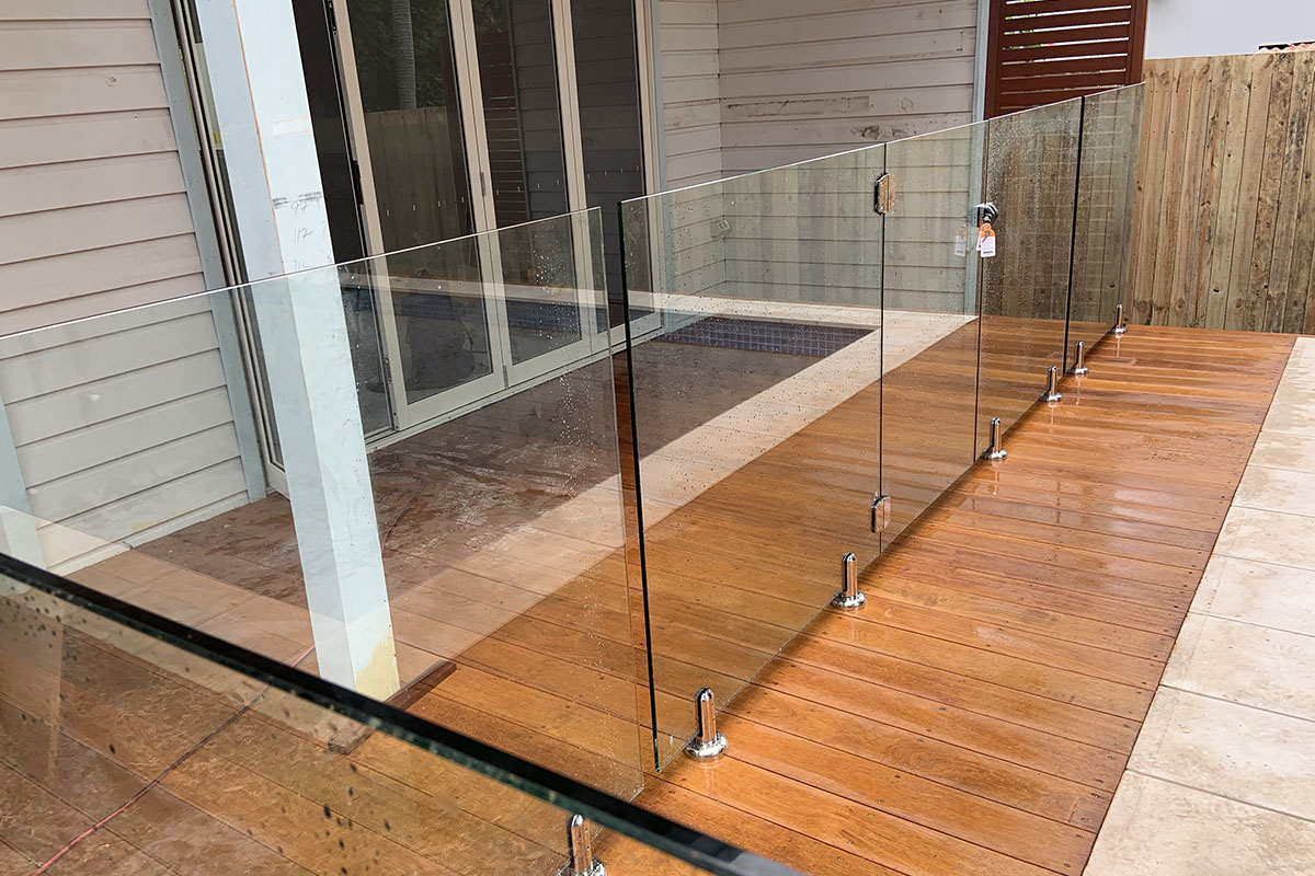 glass pool fencing and wooden outdoor floorboards on the central coast